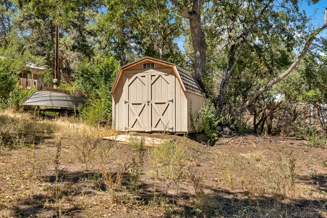 a backyard of a house with outdoor seating
