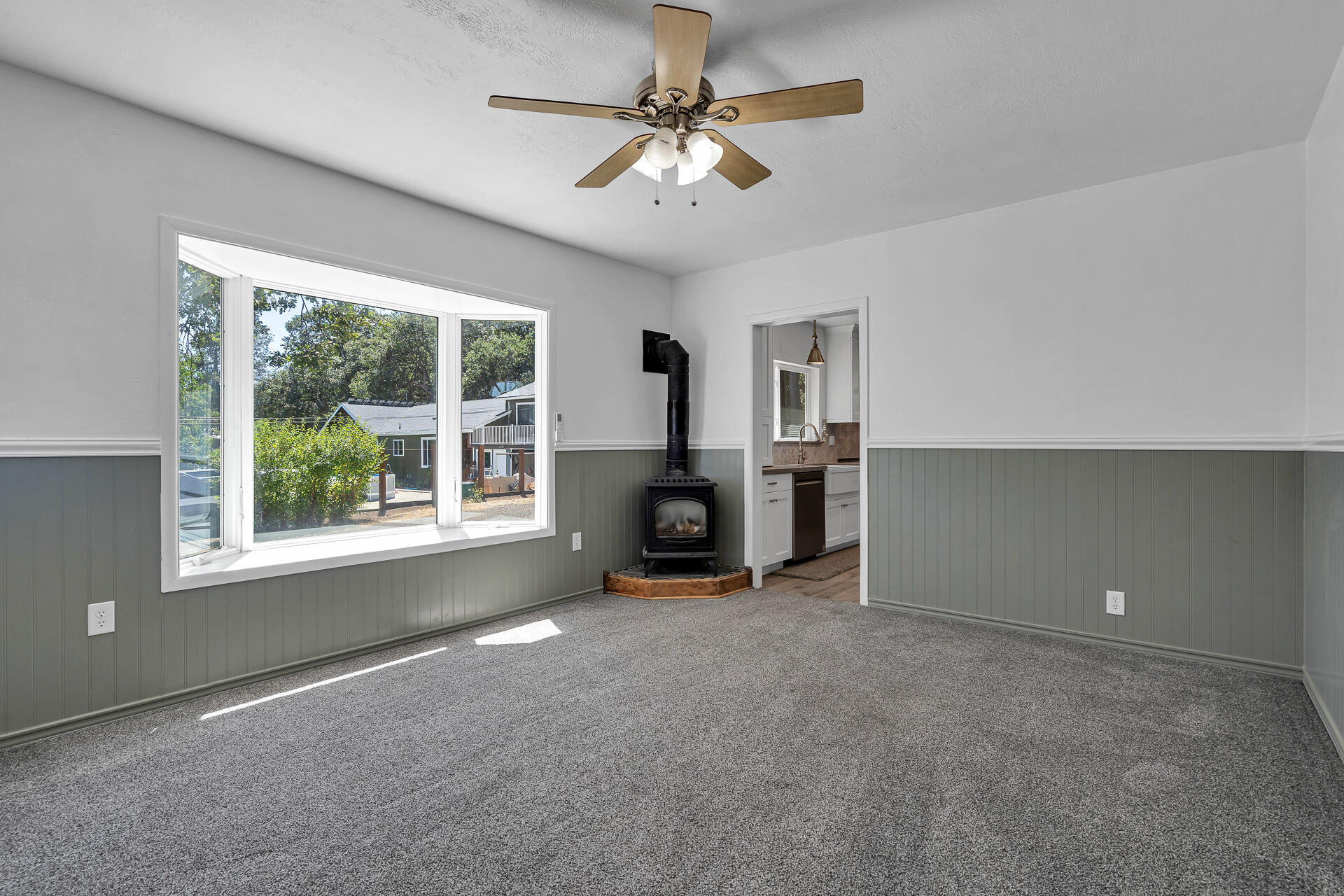 24898 Long Street Fall River Mills, CA 96028 - Photo 7 of 50 an empty room with windows and ceiling fan