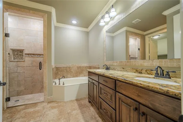 a bathroom with a granite countertop sink mirror and shower