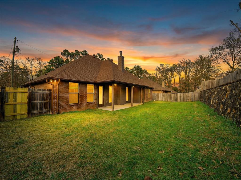 2114 West Hawkins Parkway Longview, TX 75605 - Photo 21 of 27 a view of a house with a yard