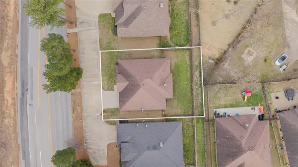 an aerial view of a house with a swimming pool