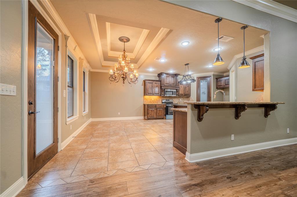 2114 West Hawkins Parkway Longview, TX 75605 - Photo 7 of 27 a view of a kitchen with a refrigerator and a window