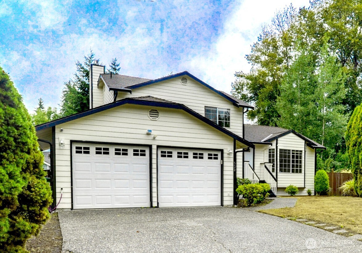 532 198th Street Southeast Bothell, WA 98012 - Photo 1 of 22 a front view of a house with a yard and garage