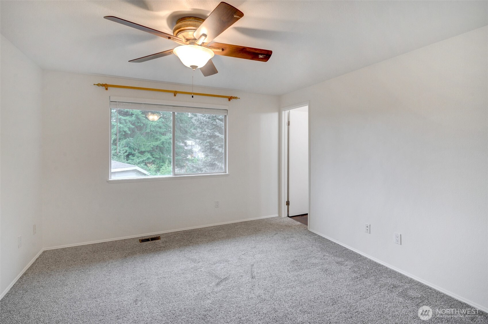 532 198th Street Southeast Bothell, WA 98012 - Photo 16 of 22 an empty room with a window and a fan