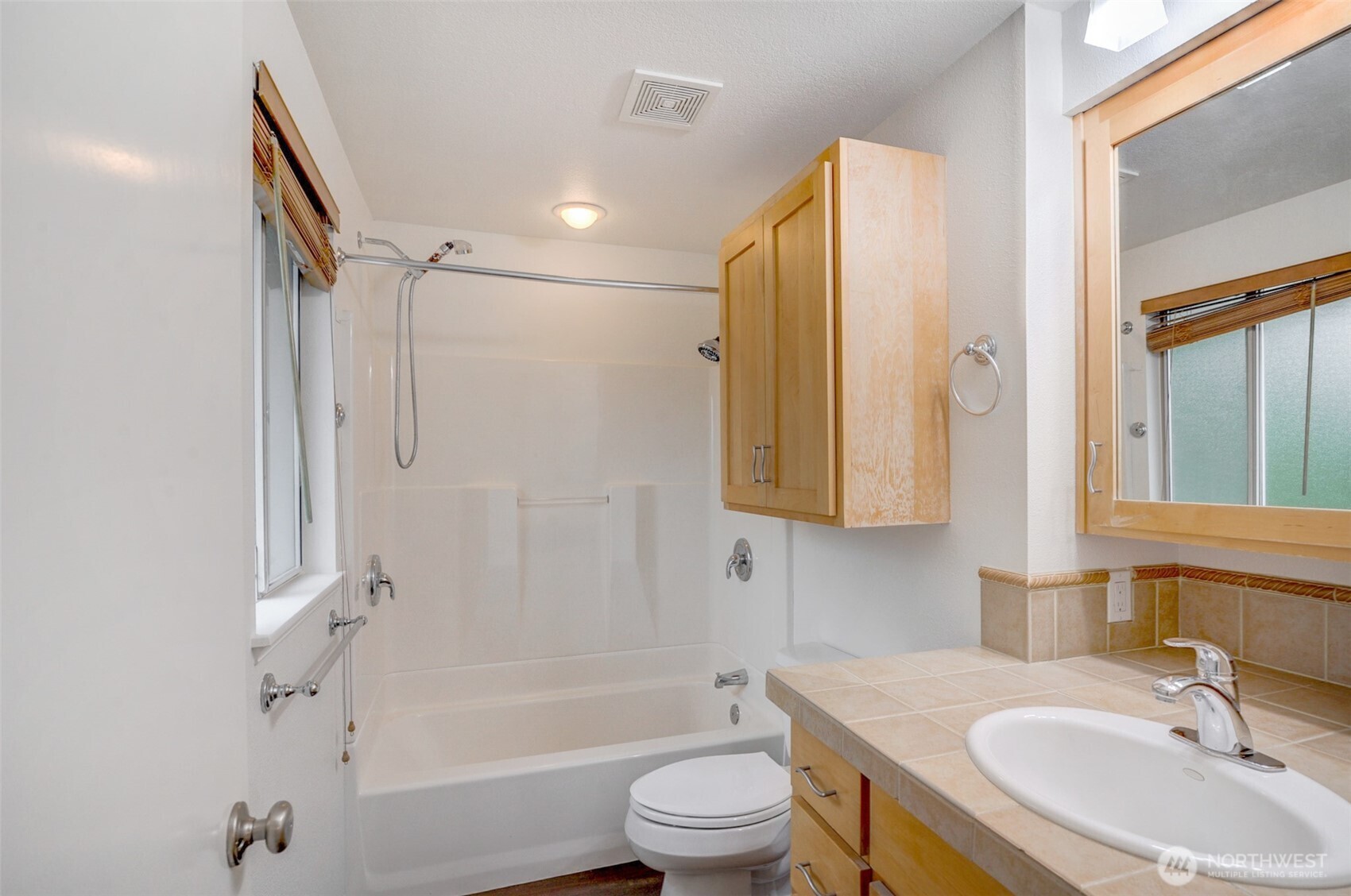 532 198th Street Southeast Bothell, WA 98012 - Photo 17 of 22 a bathroom with a sink toilet and shower