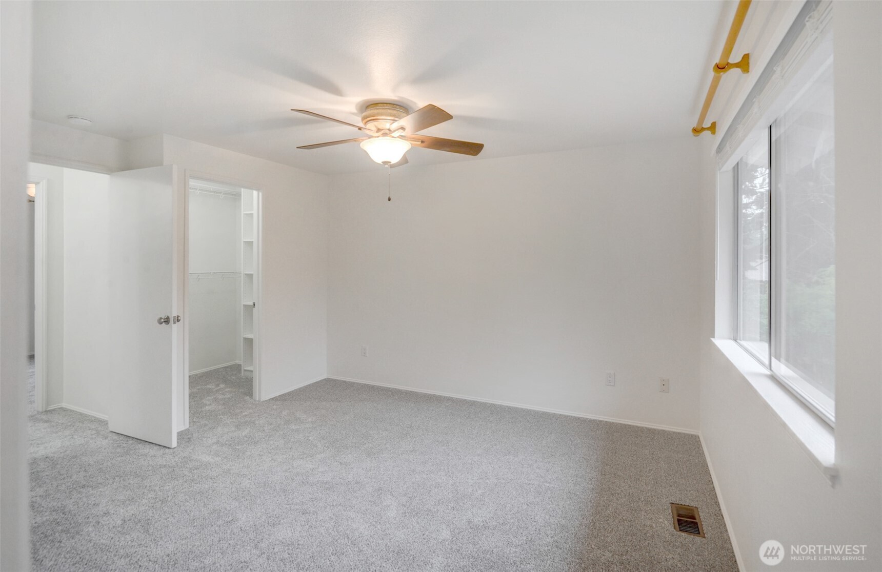 532 198th Street Southeast Bothell, WA 98012 - Photo 18 of 22 an empty room with windows and fan