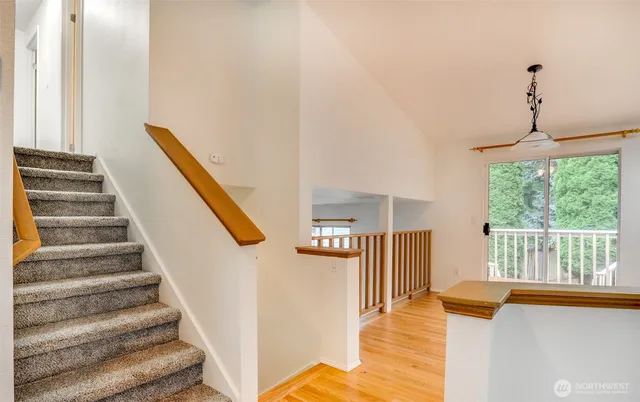 a view of a kitchen with furniture and staircase