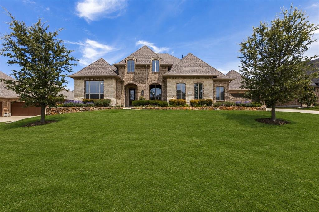 506 Life Spring Drive Rockwall, TX 75087 - Photo 1 of 36 a front view of a house with a yard