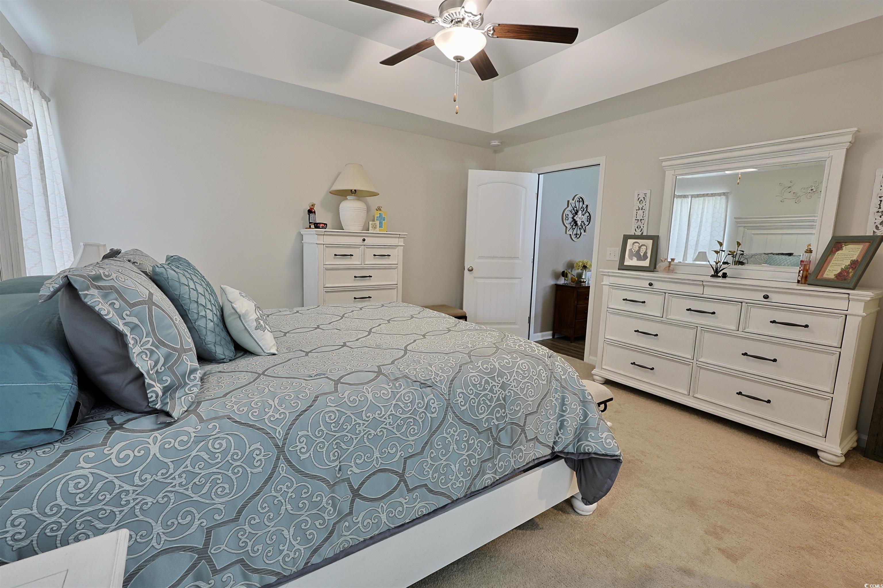 3604 Church Street Loris, SC 29569 - Photo 11 of 34 Bedroom featuring light carpet, a tray ceiling, and ceiling fan