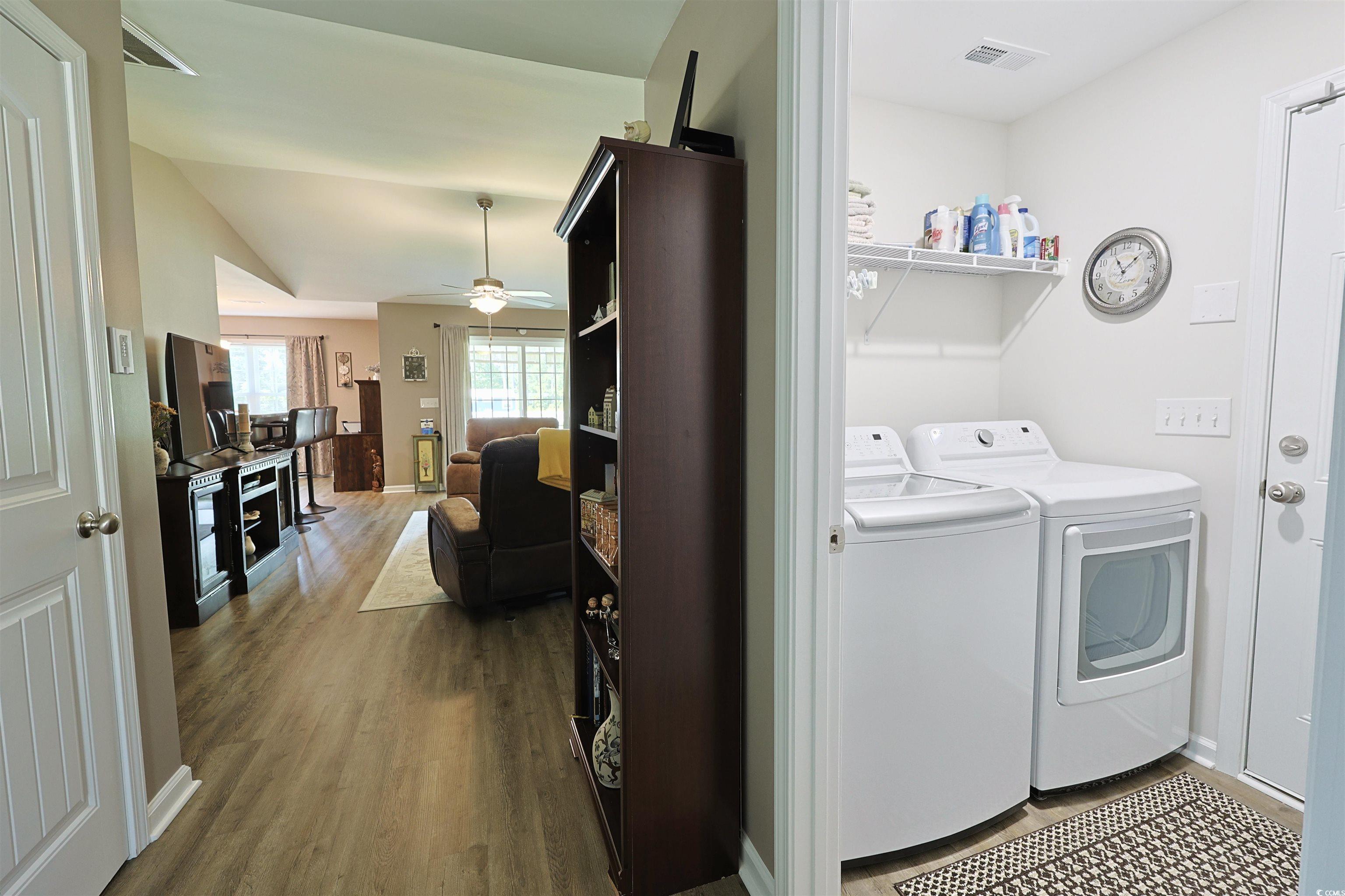 3604 Church Street Loris, SC 29569 - Photo 17 of 34 Washroom featuring wood finished floors, washer and clothes dryer, and a ceiling fan