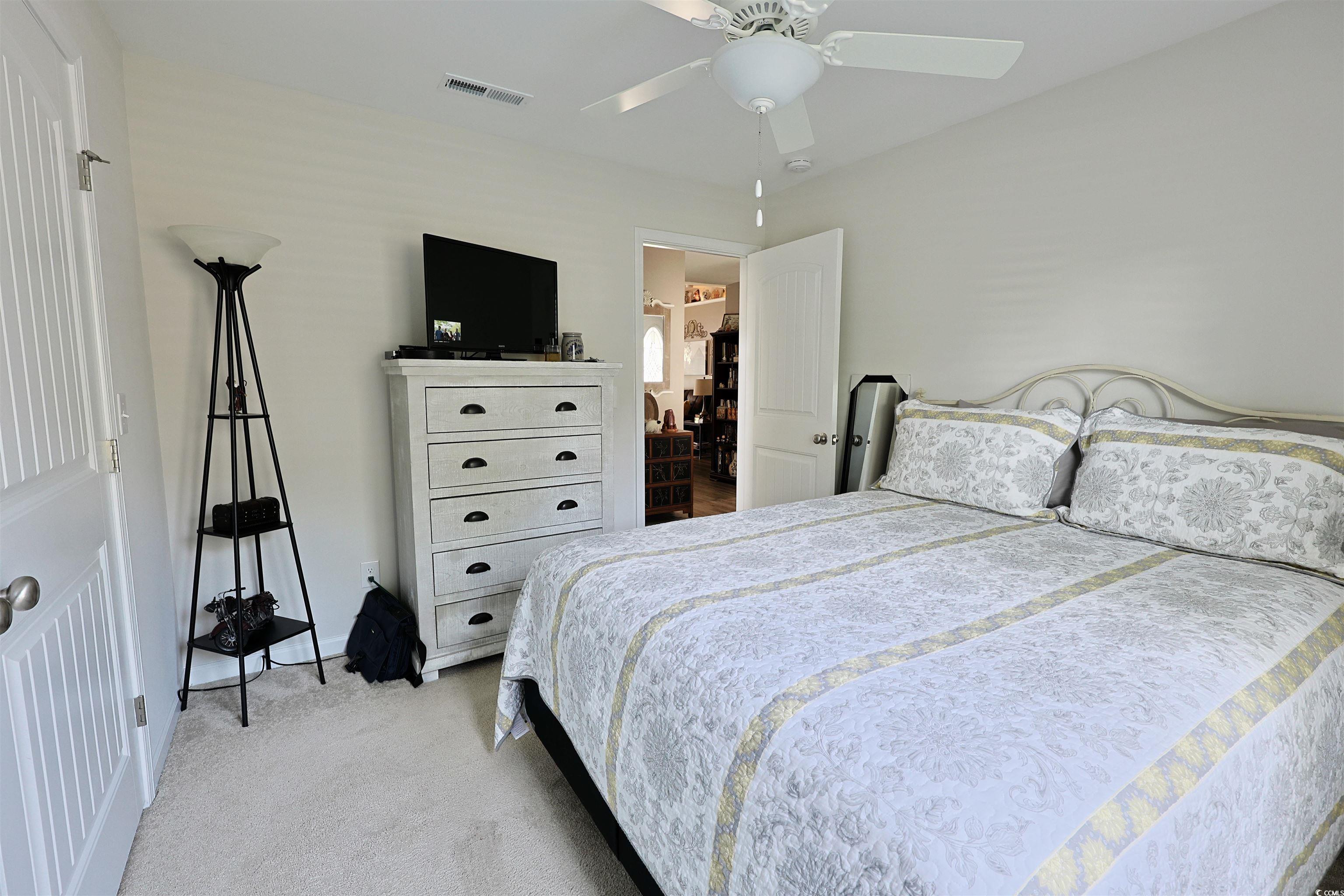 3604 Church Street Loris, SC 29569 - Photo 18 of 34 Bedroom with light colored carpet and ceiling fan