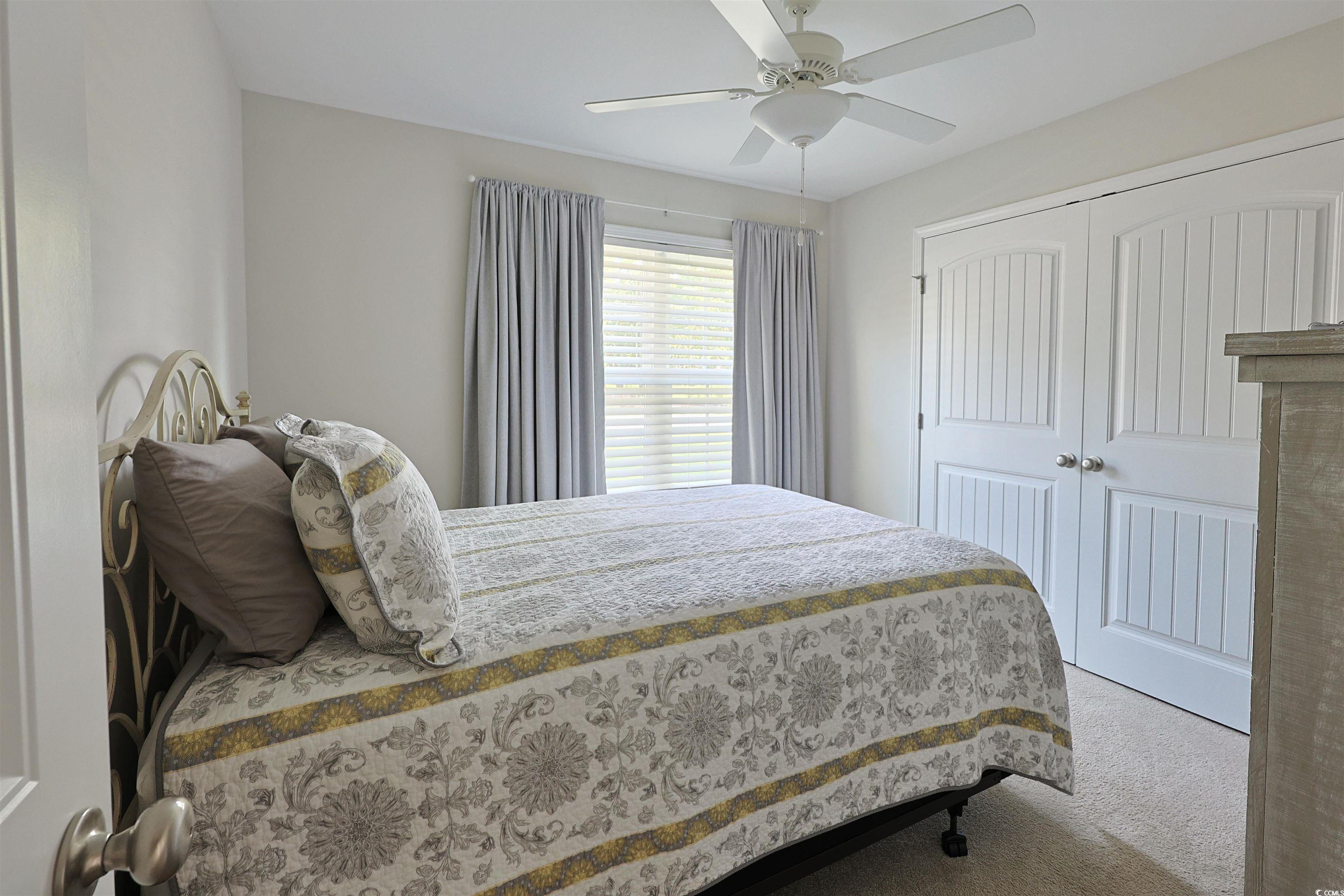 3604 Church Street Loris, SC 29569 - Photo 19 of 34 Bedroom with carpet floors, a closet, and ceiling fan