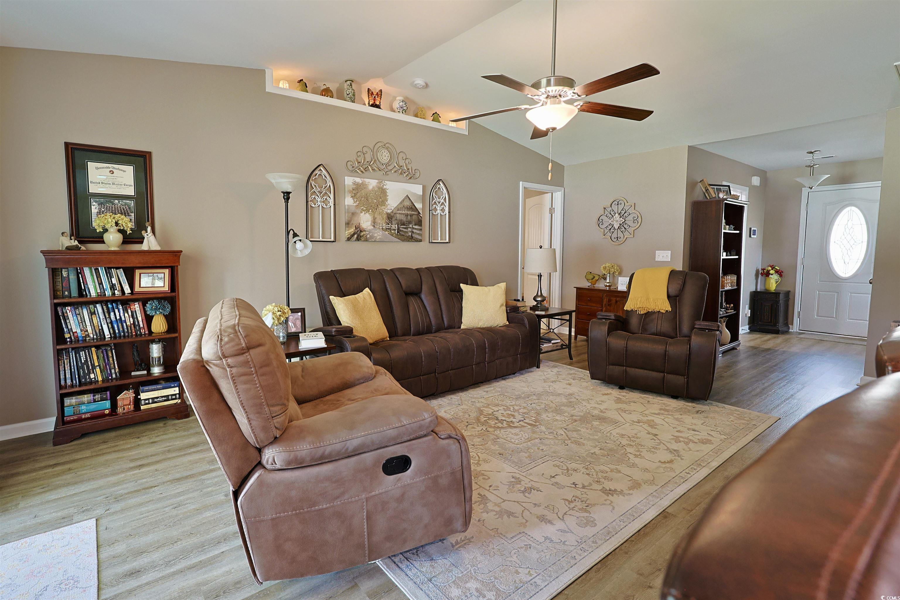 3604 Church Street Loris, SC 29569 - Photo 2 of 34 Living area with lofted ceiling, wood finished floors, and a ceiling fan