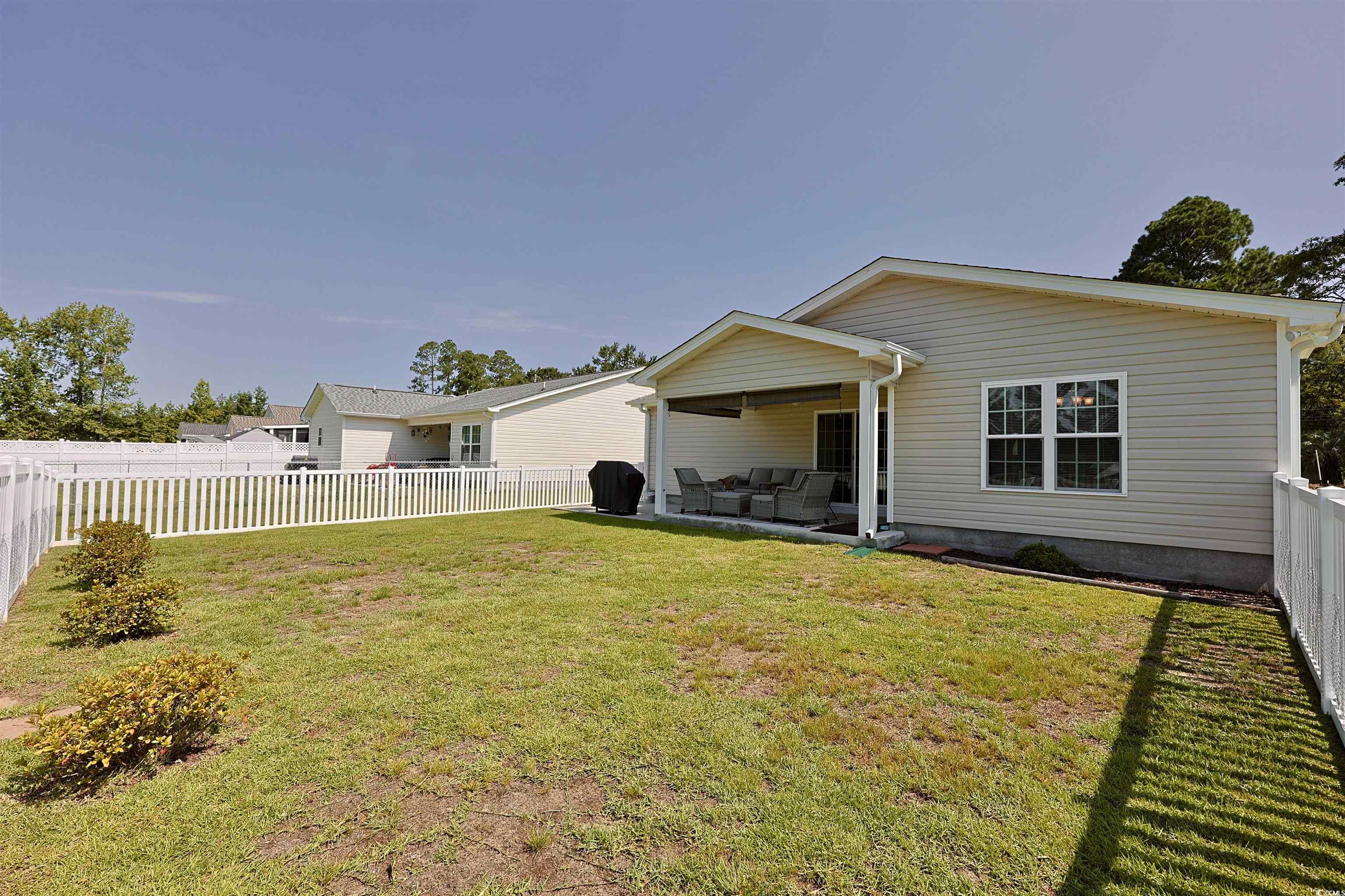 3604 Church Street Loris, SC 29569 - Photo 27 of 34 Rear view of property featuring a fenced backyard and a patio