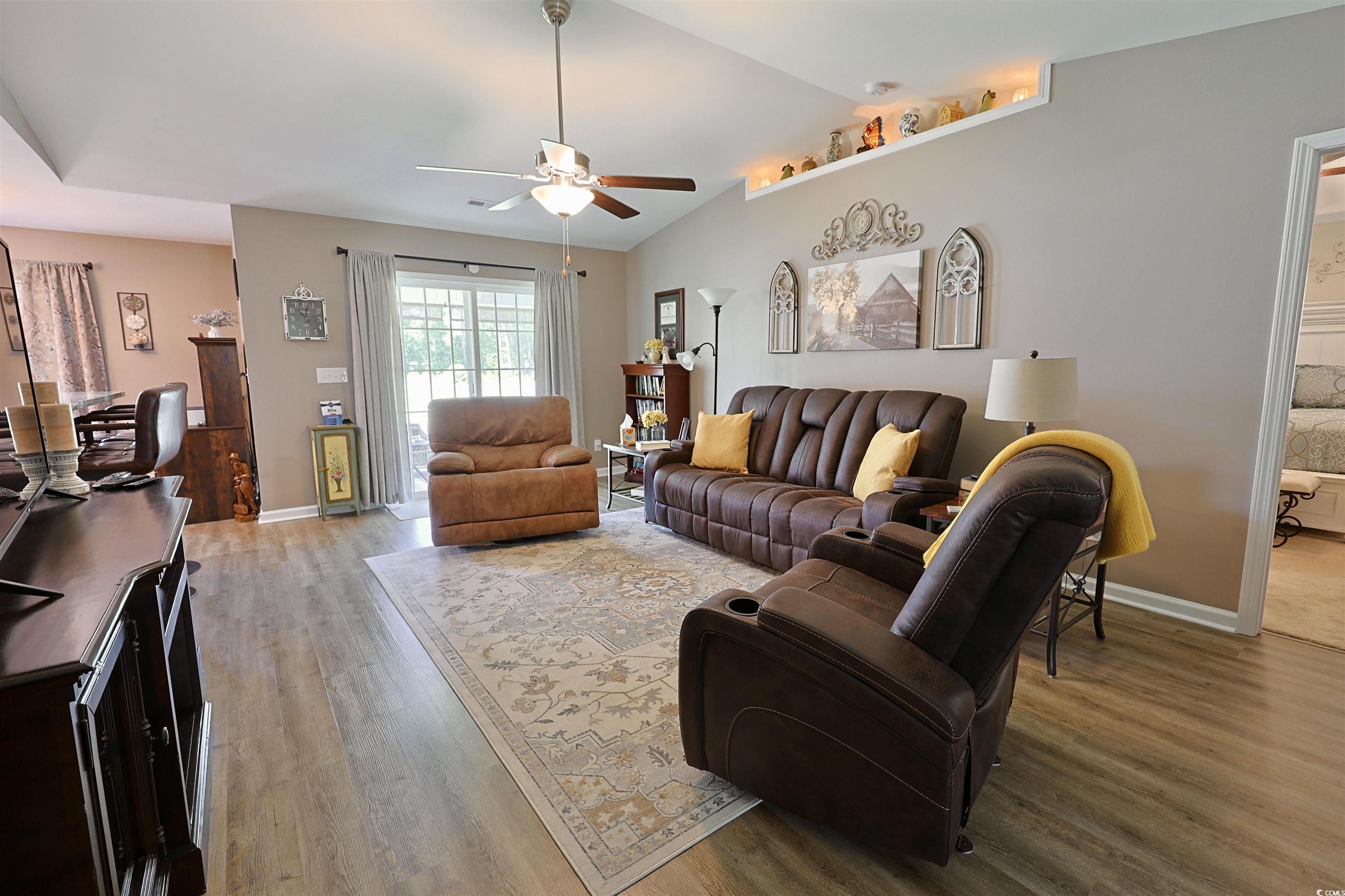 3604 Church Street Loris, SC 29569 - Photo 3 of 34 Living area featuring wood finished floors, a ceiling fan, and vaulted ceiling