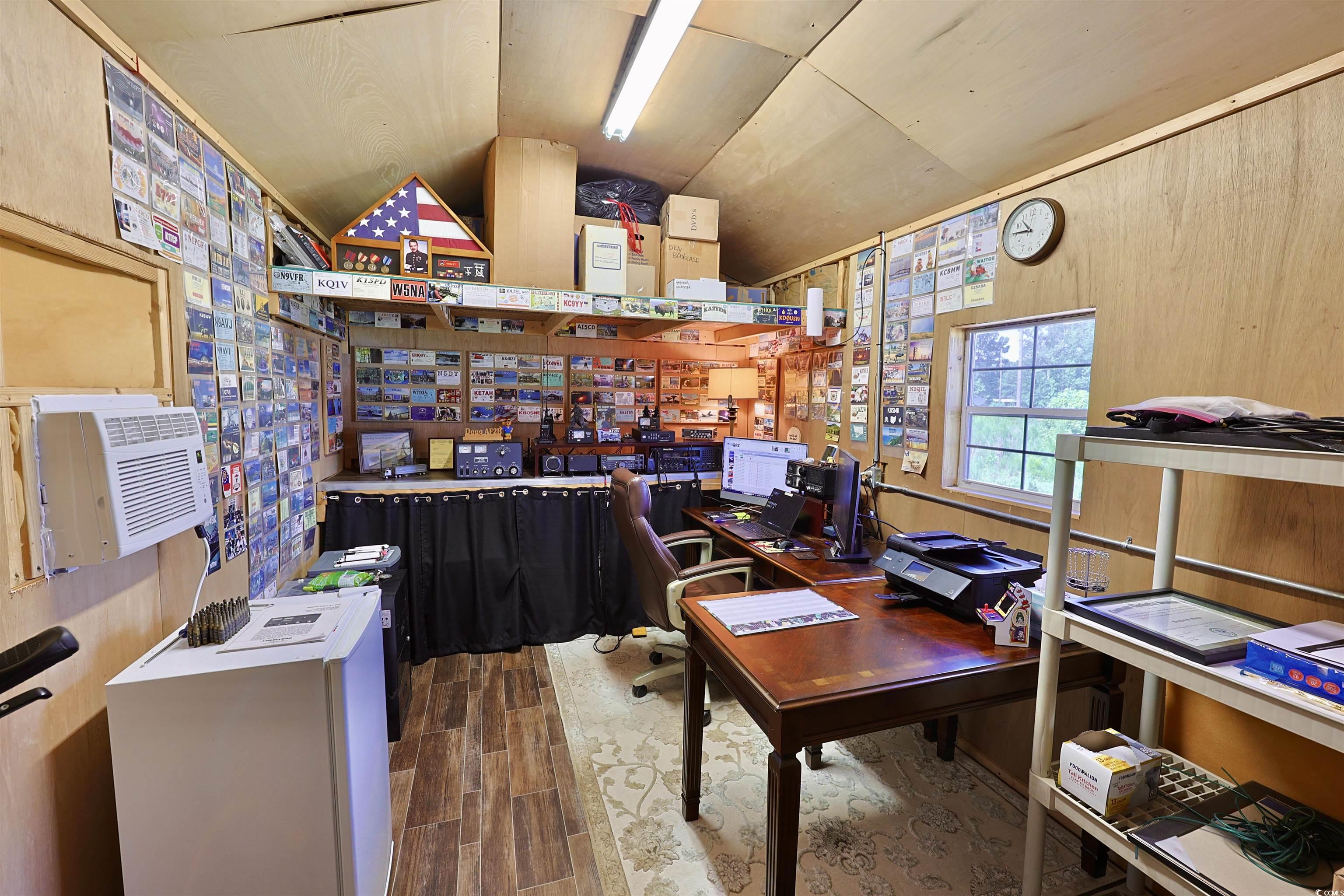 3604 Church Street Loris, SC 29569 - Photo 31 of 34 Home office featuring lofted ceiling, wood finished floors, and cooling unit