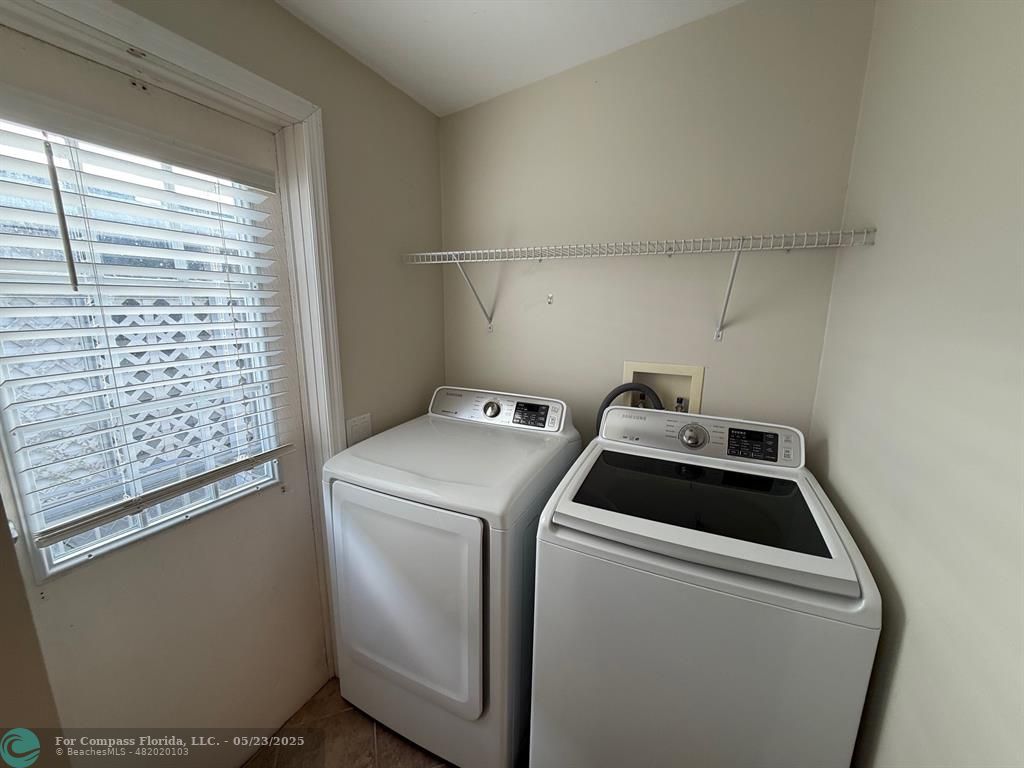 8550 Southwest 23rd Place Davie, FL 33324 - Photo 9 of 9 a utility room with dryer and washer