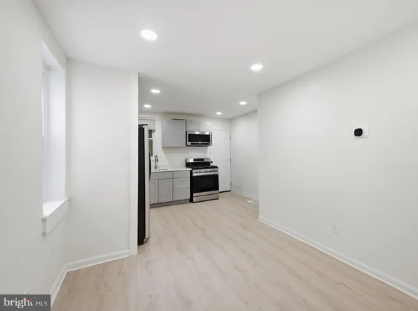 a view of kitchen with wooden floor