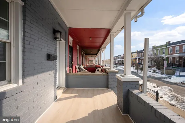 a dining room with a large window and furniture