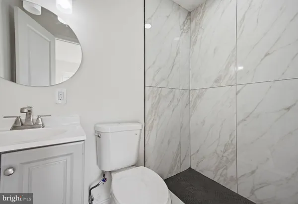 a bathroom with a shower and a shower