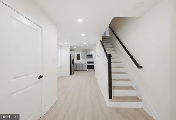 a view of entryway with wooden floor