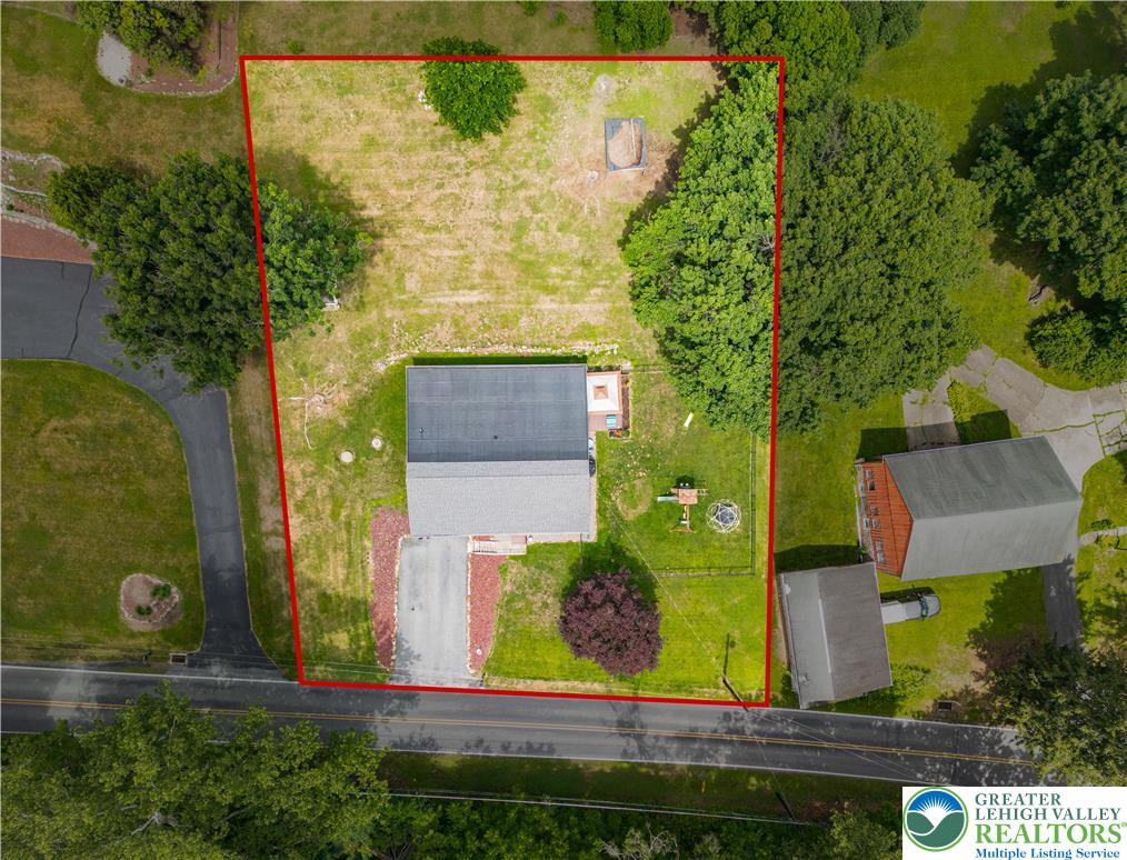 50 Kohls Road Northampton, PA 18067 - Photo 43 of 54 An aerial perspective reveals a generous lot with a home, ample yard, and surrounding greenery.