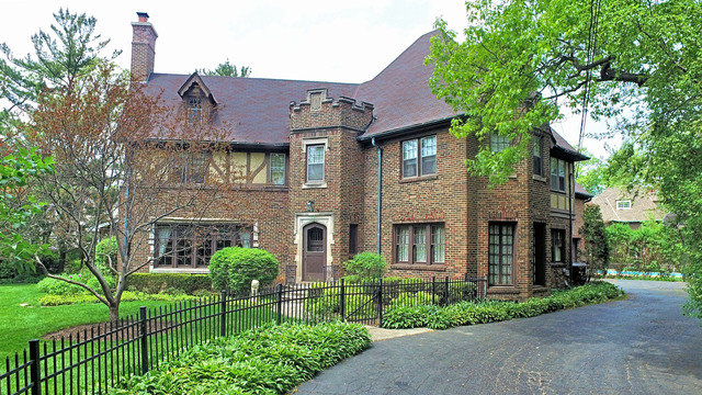 1201 Chatfield Road Winnetka, IL 60093 - Photo 1 of 25 a front view of a house with a yard and plants
