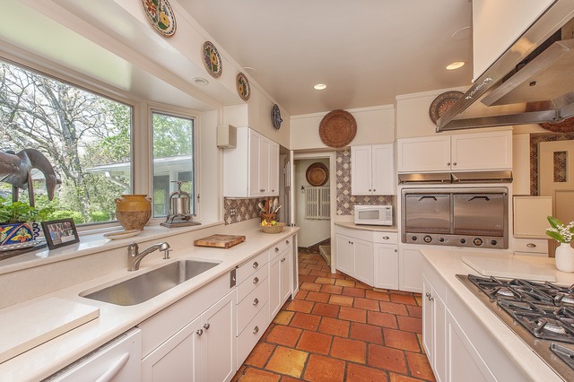1201 Chatfield Road Winnetka, IL 60093 - Photo 13 of 25 a large kitchen with a sink stainless steel appliances and cabinets