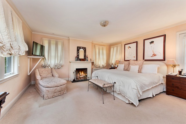 1201 Chatfield Road Winnetka, IL 60093 - Photo 16 of 25 a spacious bedroom with a bed and a fireplace