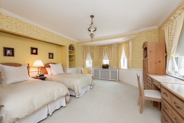 1201 Chatfield Road Winnetka, IL 60093 - Photo 17 of 25 a bedroom with bed and a chandelier