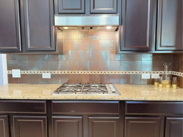 an empty room with closet and a chandelier fan