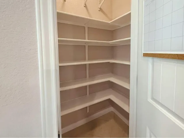 a spacious bathroom with a tub sink shower and mirror