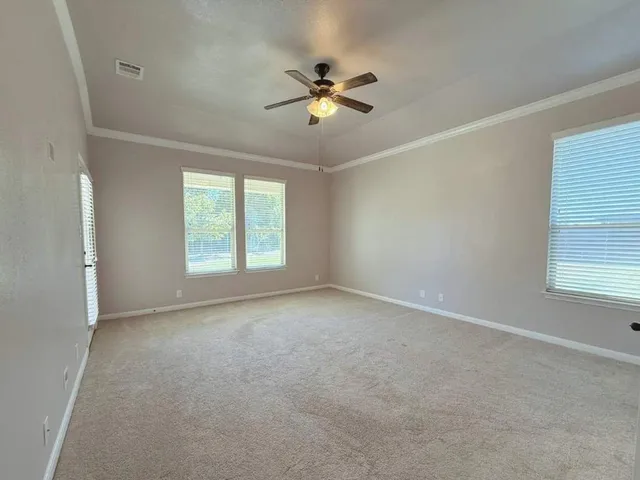 a view of a patio with a table chairs and a table