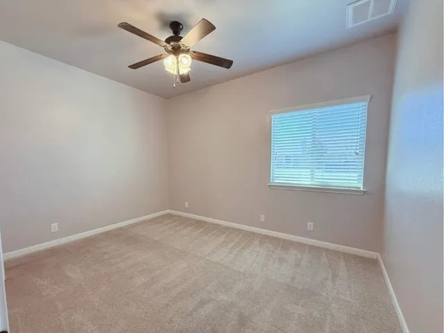 a view of a livingroom with furniture and a window