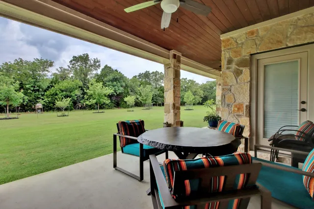a view of a park with large trees