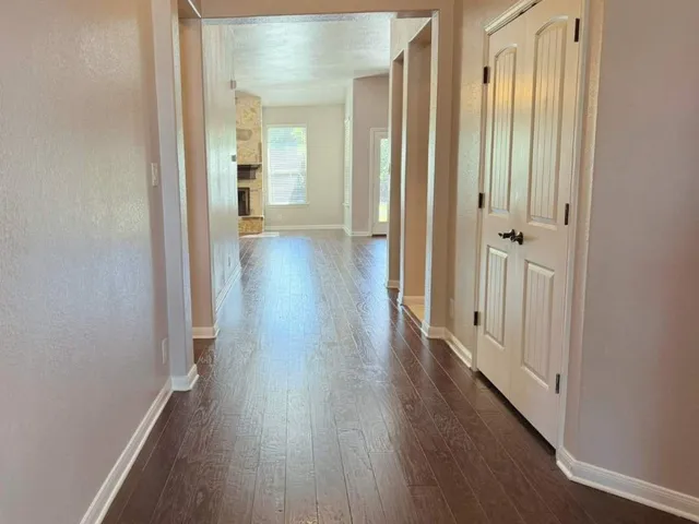 a kitchen with a stove sink and cabinets