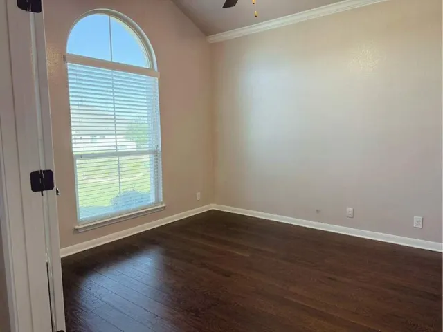a kitchen with stainless steel appliances kitchen island granite countertop a refrigerator stove and sink