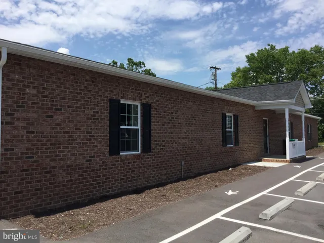 a front view of a house with a garage