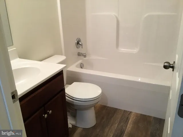 a bathroom with a sink toilet and bathtub