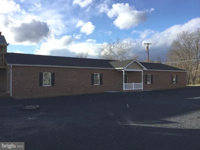 a view of a house with a street
