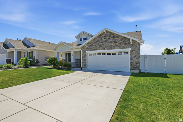 1175 Silver Hollow Road Syracuse, UT 84075 - Photo 3 of 34 Contemporary single-story residence featuring a stone and siding exterior