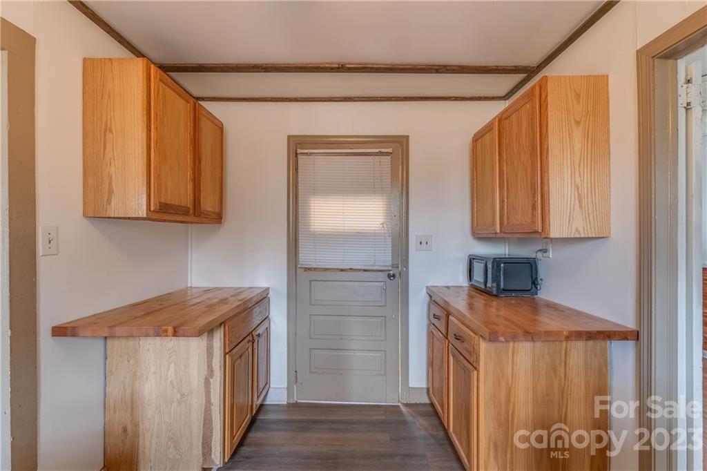 26 Markley Drive East Flat Rock, NC 28726 - Photo 11 of 27 a kitchen with stainless steel appliances granite countertop a refrigerator and a stove top oven