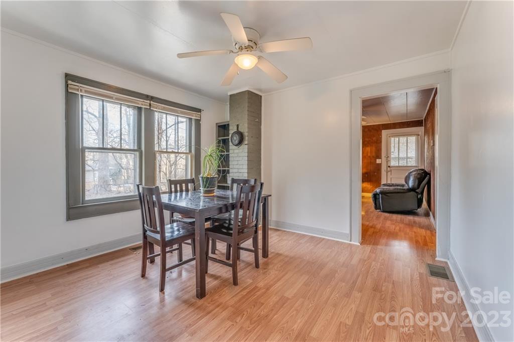 26 Markley Drive East Flat Rock, NC 28726 - Photo 13 of 27 a view of a dining room with furniture window and wooden floor