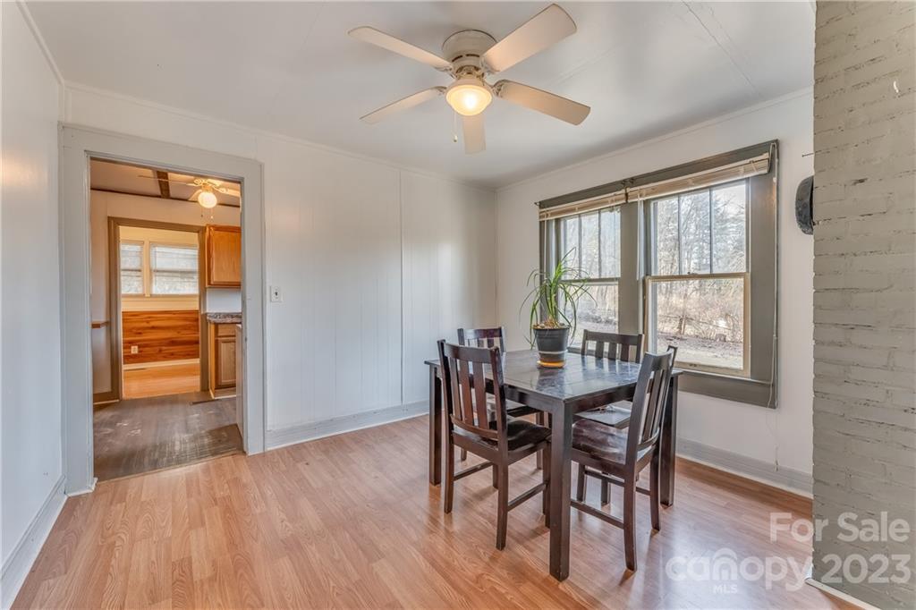 26 Markley Drive East Flat Rock, NC 28726 - Photo 15 of 27 a view of a dining room with furniture window and wooden floor