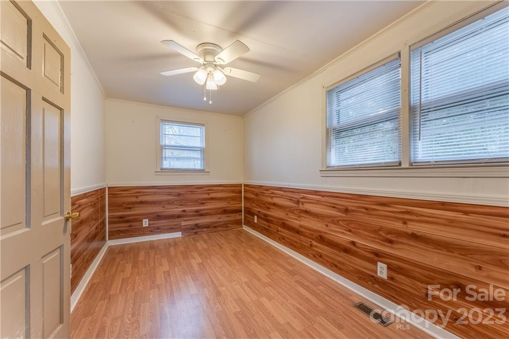 26 Markley Drive East Flat Rock, NC 28726 - Photo 18 of 27 a view of an empty room with wooden floor and a window