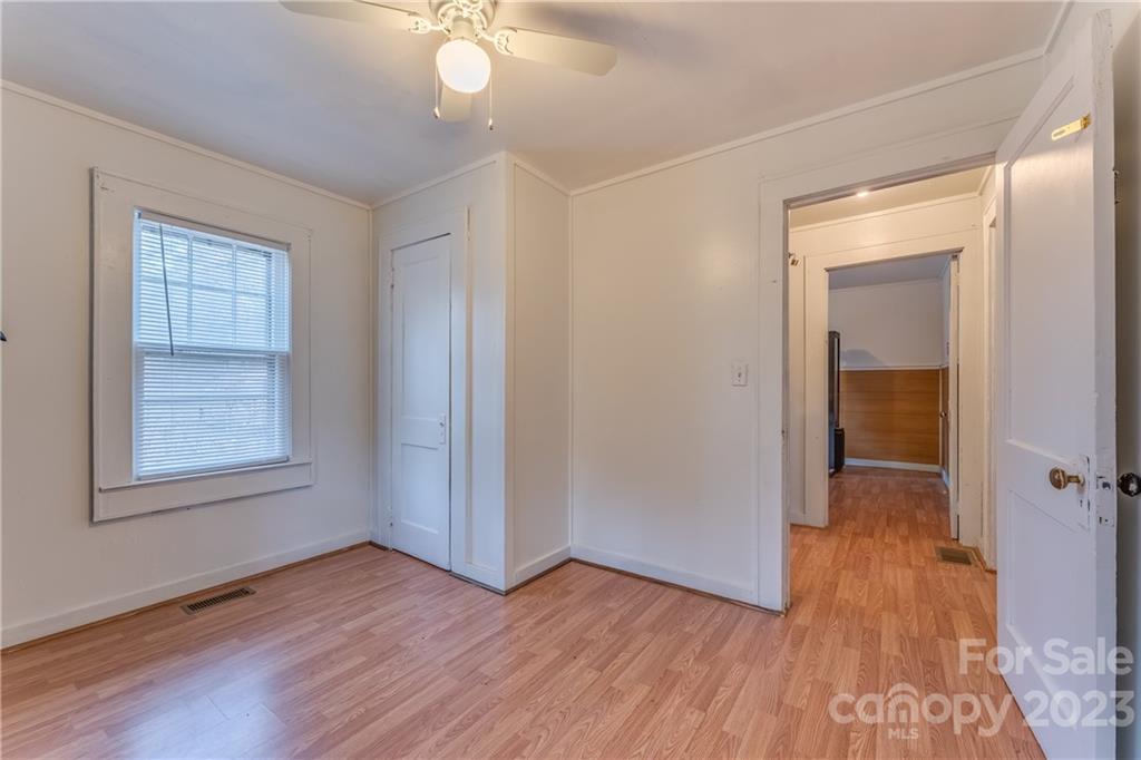 26 Markley Drive East Flat Rock, NC 28726 - Photo 19 of 27 an empty room with wooden floor and windows