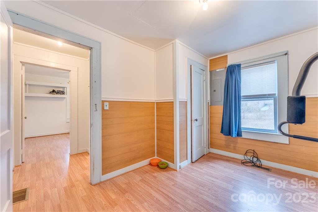 26 Markley Drive East Flat Rock, NC 28726 - Photo 20 of 27 an empty room with wooden floor and windows