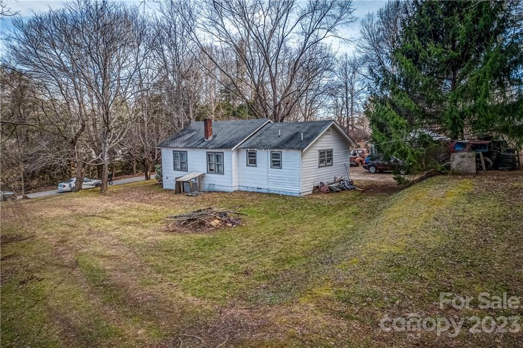26 Markley Drive East Flat Rock, NC 28726 - Photo 2 of 27 a view of a house with a yard and large tree