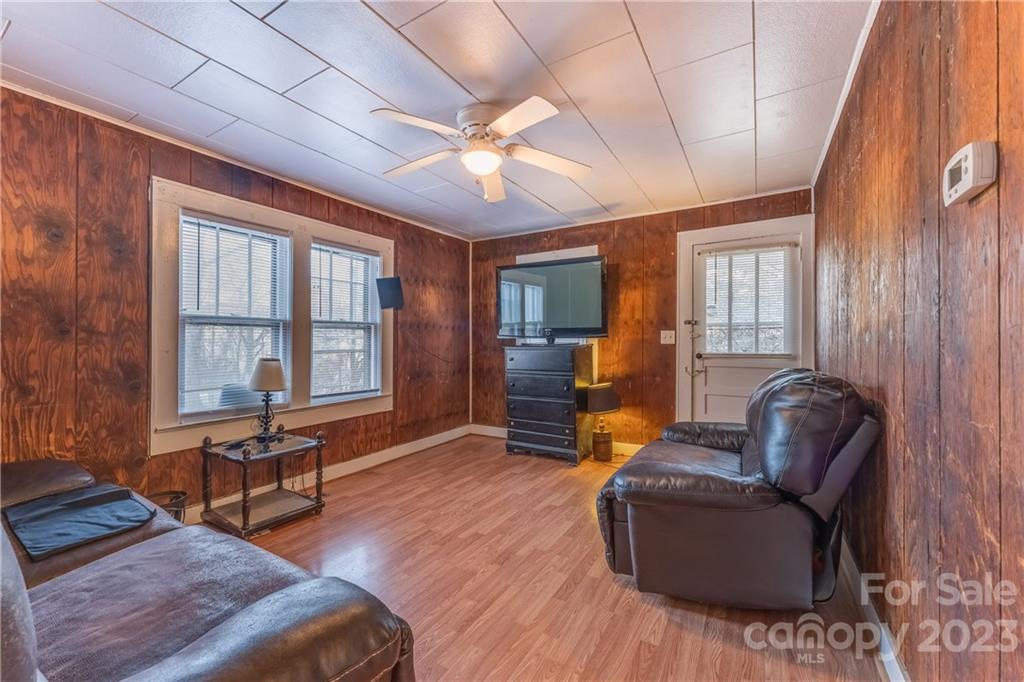 26 Markley Drive East Flat Rock, NC 28726 - Photo 6 of 27 a living room with furniture two window and a flat screen tv