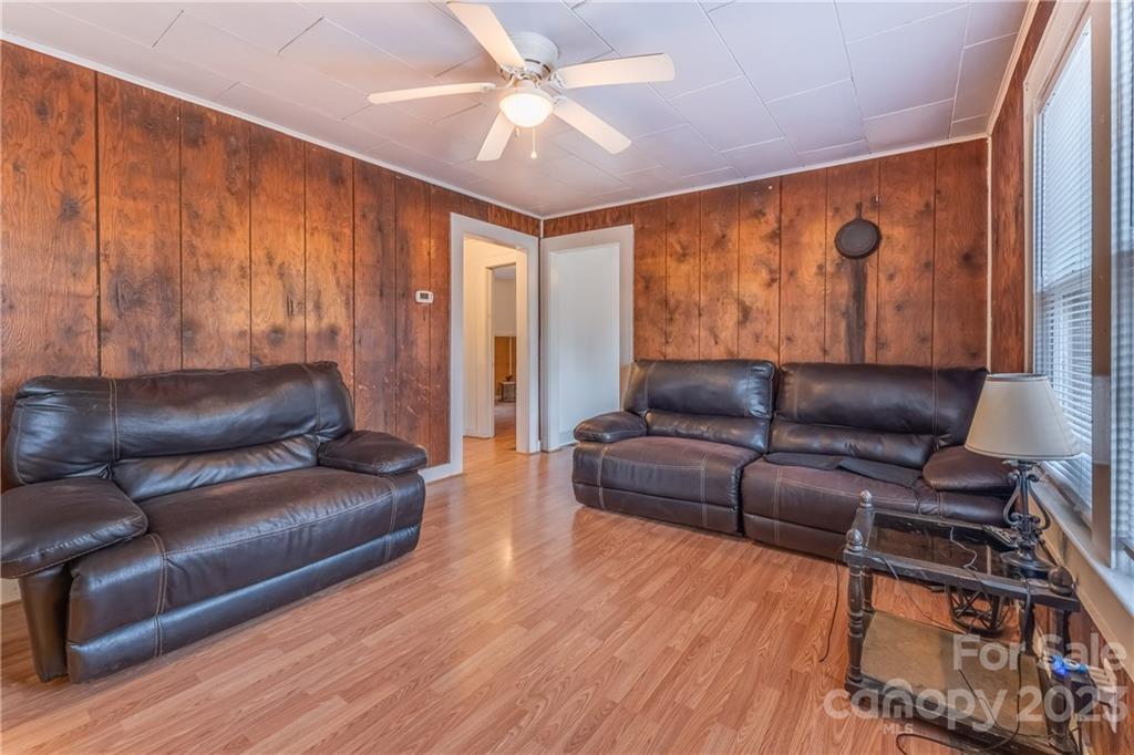 26 Markley Drive East Flat Rock, NC 28726 - Photo 7 of 27 a living room with furniture and wooden floor